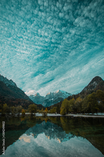 Beautiful lake jasna in kranjska gora with visible reflections of Razor and Skrlatica in the water in early autumn