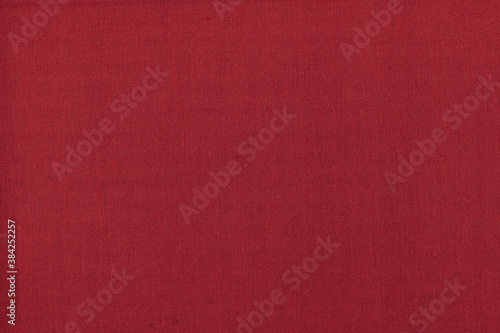 Vintage and old looking paper background. Colored red retro book cover. Ancient book page.