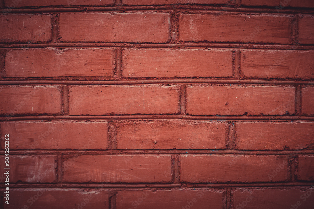 Obraz premium old brick wall of dark scarlet color. close-up