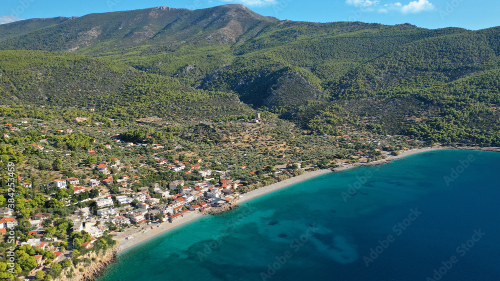Obraz premium Aerial drone photo of beautiful seaside village and turquoise beach of Porto Germeno, Corinthian gulf, West Attica, Greece