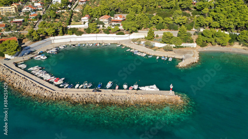 Aerial drone photo of beautiful seaside village and turquoise beach of Porto Germeno, Corinthian gulf, West Attica, Greece © aerial-drone