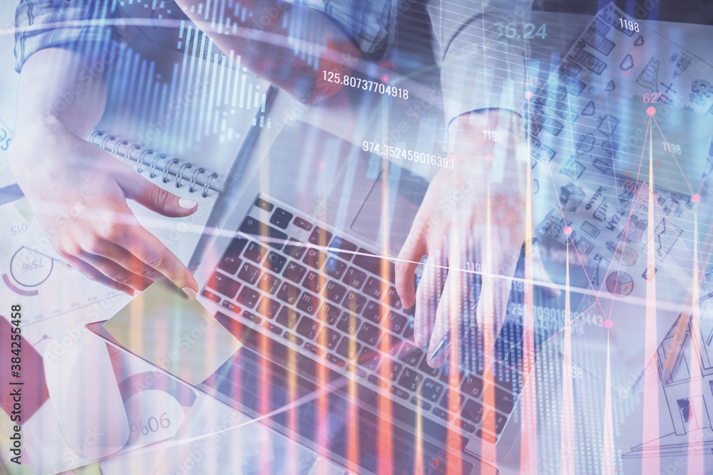 Double exposure of man and woman working together and forex graph hologram drawing. Financial analysis concept. Computer background. Top View. Double exposure of man and woman working together and forex graph hologram drawing. Financial analysis concept. Computer background. Top View.