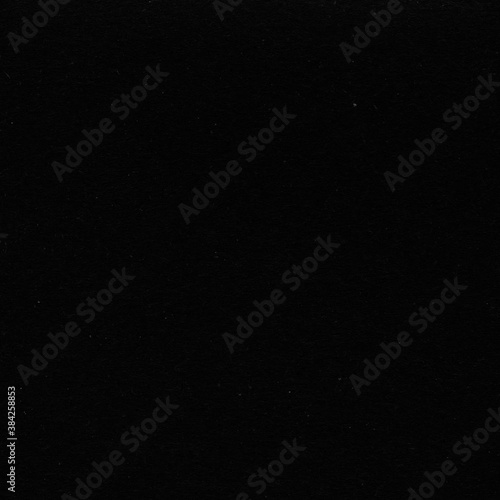 A black vintage rough sheet of carton. Recycled environmentally friendly cardboard paper texture. Simple gray minimalist papercraft background.