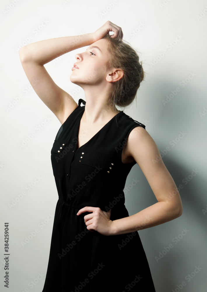 Fototapeta premium young fashion blond woman in black dress
