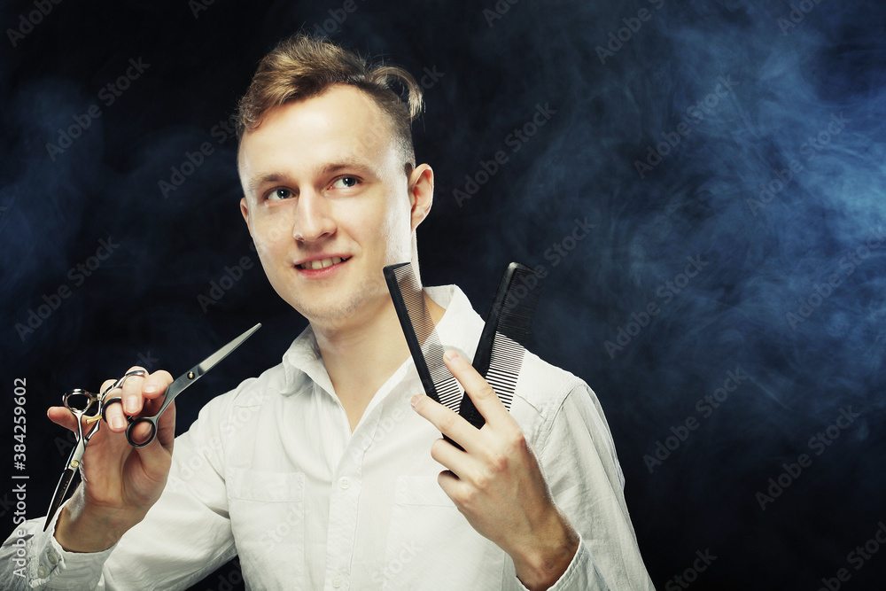 Fototapeta premium portrait of young t hairstylist looking at camera