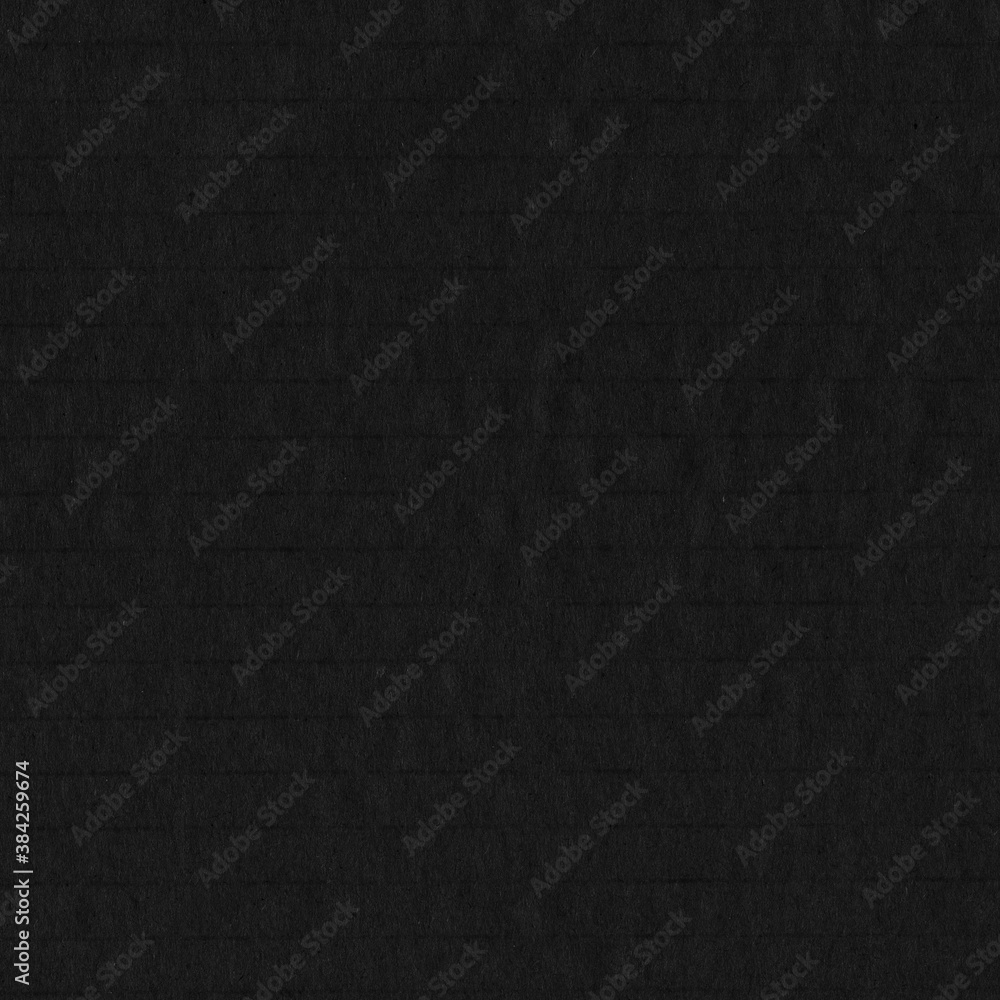 Fototapeta premium A black vintage rough sheet of carton. Recycled environmentally friendly cardboard paper texture. Simple gray minimalist papercraft background.