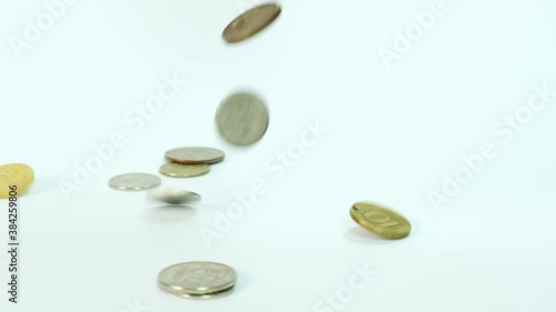 Coins rubles falling down in slow motion against white background, saving money for business and financial concept, save for retirement planning photo