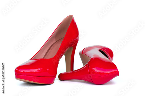 Red women's high-heeled shoes isolated on white background