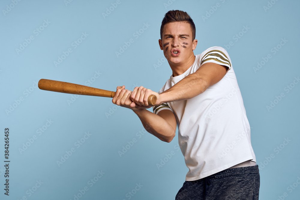 baseball guy with a bat in his hand on a blue background and a combat color on his face makeup model t-shirt baseball guy with a bat in his hand on a blue background and a combat color on his face makeup model t-shirt