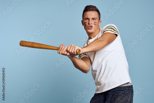 baseball guy with a bat in his hand on a blue background and a combat color on his face makeup model t-shirt