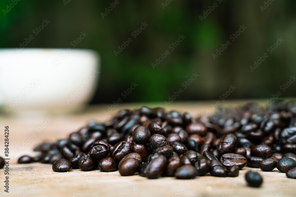 Coffee beans on old rusty brown wood background Coffee beans on old rusty brown wood background