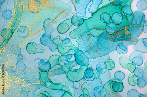 Abstract watercolor blue, green and gold texture. Ink transparent background.