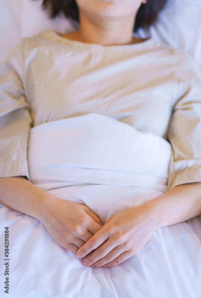 middle aged woman get up early on the bed middle aged woman get up early on the bed