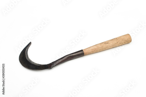 Sickle for cutting grass on white background.