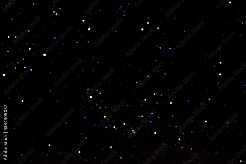 Stars on a dark night sky. Blurred, defocus. Abstract background