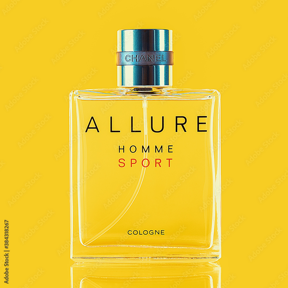 A bottle of Chanel perfume on a uniform yellow background, with a  reflection of the lower part. Allure men's perfume series. 2020-07-05  Samara. Stock Photo