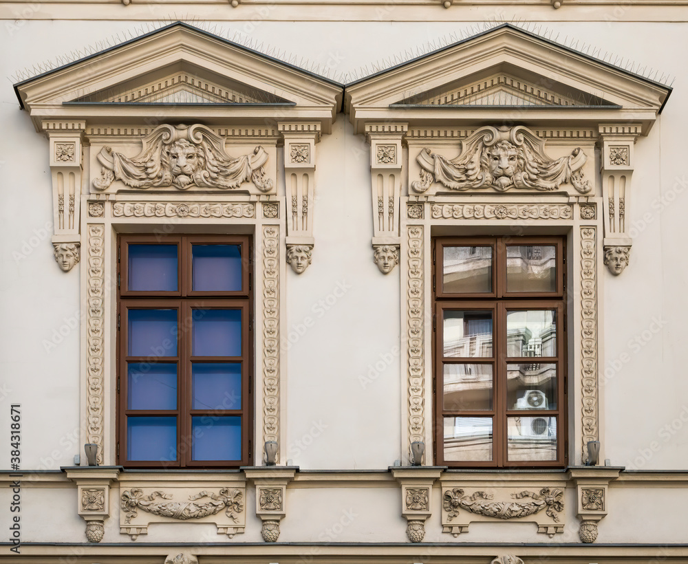 Architectural detail with the windows of an old building. Old vintage architecture in the center of Bucharest, Romania.