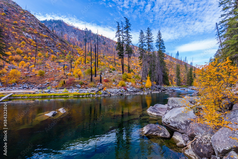 Transparent river in the mountains, amazing autumn. Wenatchee river, HWY-2, USA