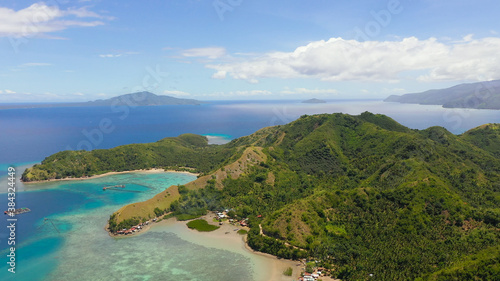 Famous Tourist Site: Sleeping Dinosaur Island located on the island of Mindanao, Philippines. Aerial view of tropical islands and blue sea.