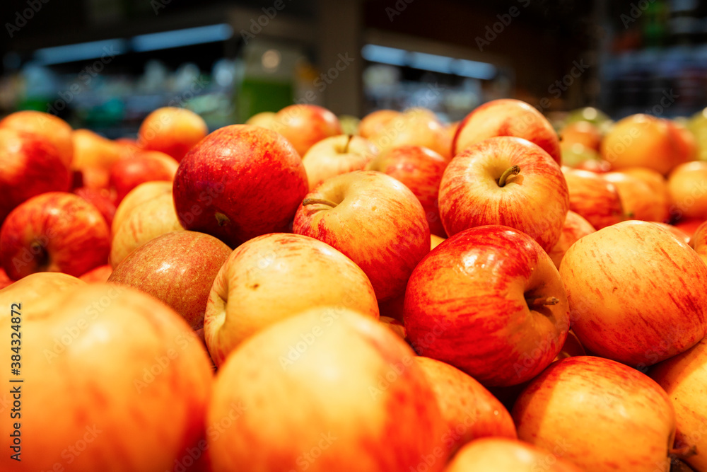 Many bright juicy red apples on the counter. Healthy eating and vegetarianism. Many bright juicy red apples on the counter. Healthy eating and vegetarianism.