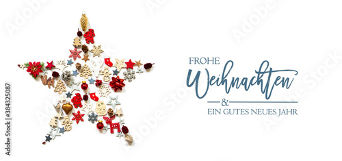 Christmas Star Build Of Vairous Christmas Decoration And Ornaments. German Text Frohe Weihnachten Und Ein Gutes Neues Jahr Means Merry Christmas And A Happy New Year. White Isolated Background