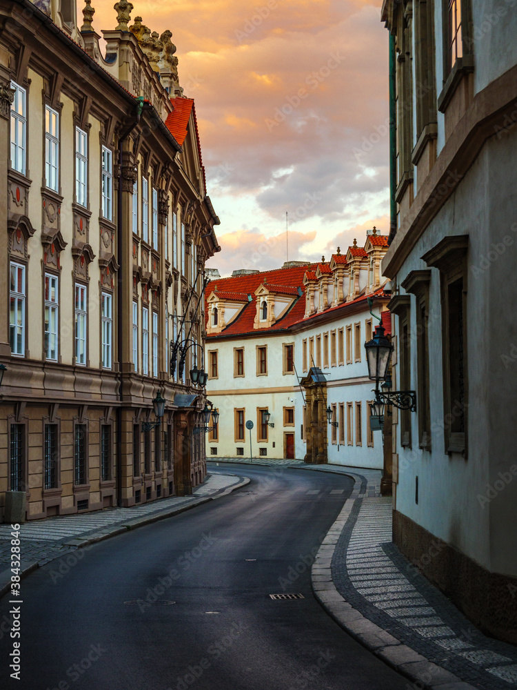 Fototapeta premium Dramatic sunset on an empty historic street in Prague