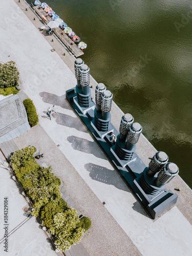 Aerial view and drone shot of Cologne architecture near a lake with boats in Germany  photo