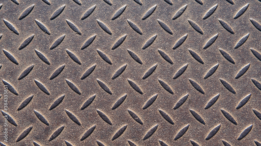 Abstract metallic background. Old metal plate with a seamless repeating pattern. An interesting steel pattern for your projects. Abstract metallic background. Old metal plate with a seamless repeating pattern. An interesting steel pattern for your projects.