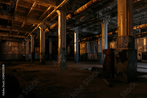 Принти на полотні Dark creepy empty abandoned industrial building interior at night