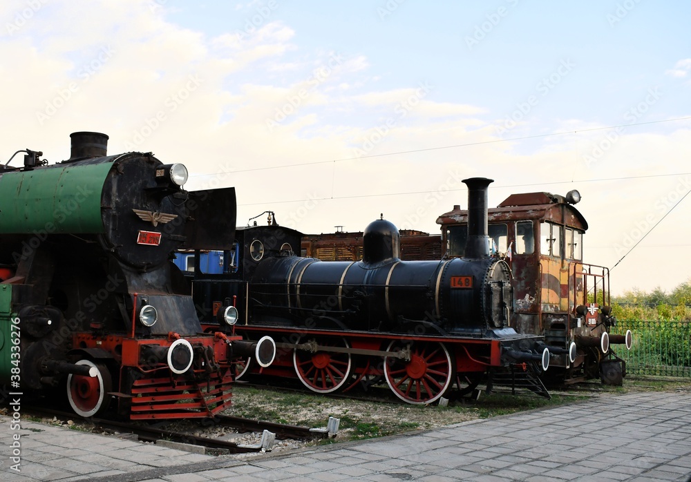 Naklejka premium Old locomotive iron equipment rusty machine train parking closeup background