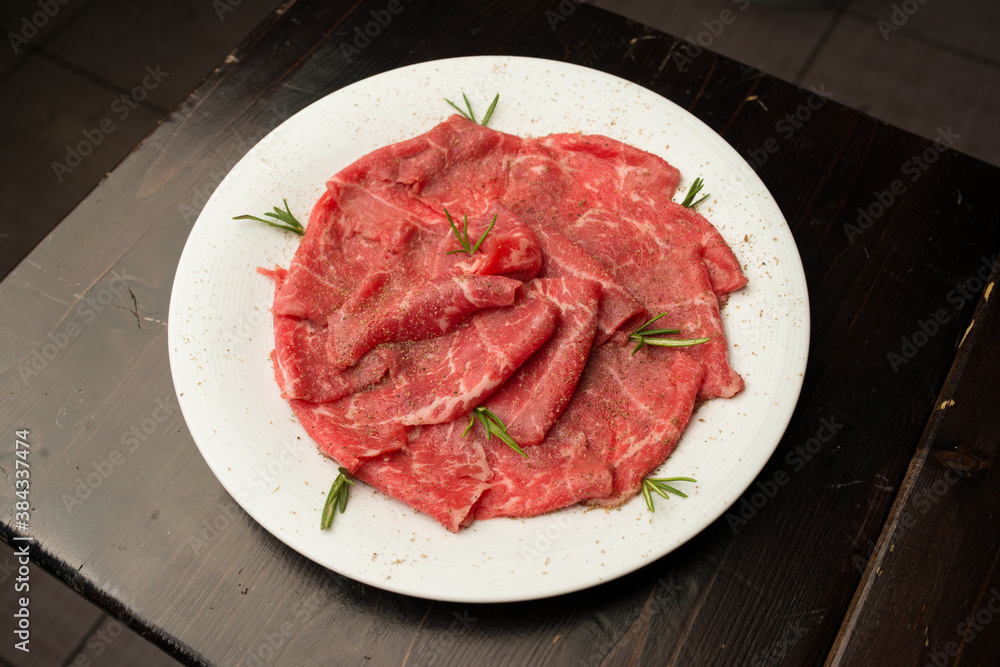 raw meat for a grill on a plate