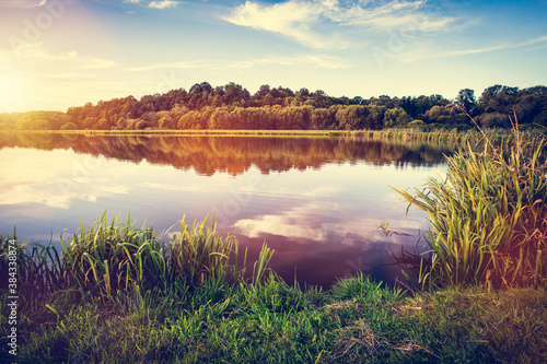 Fototapeta Naklejka Na Ścianę i Meble -  Lake at sunset. Countryside rural scenery in Poland