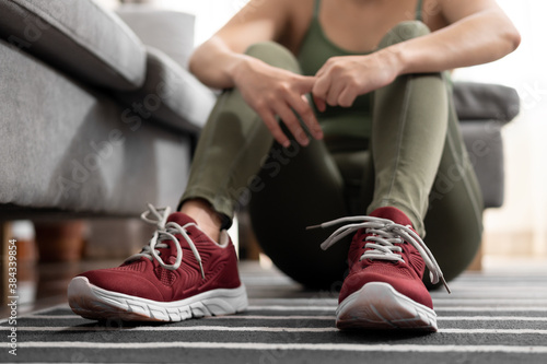 Close up woman taking a break after exercise at home