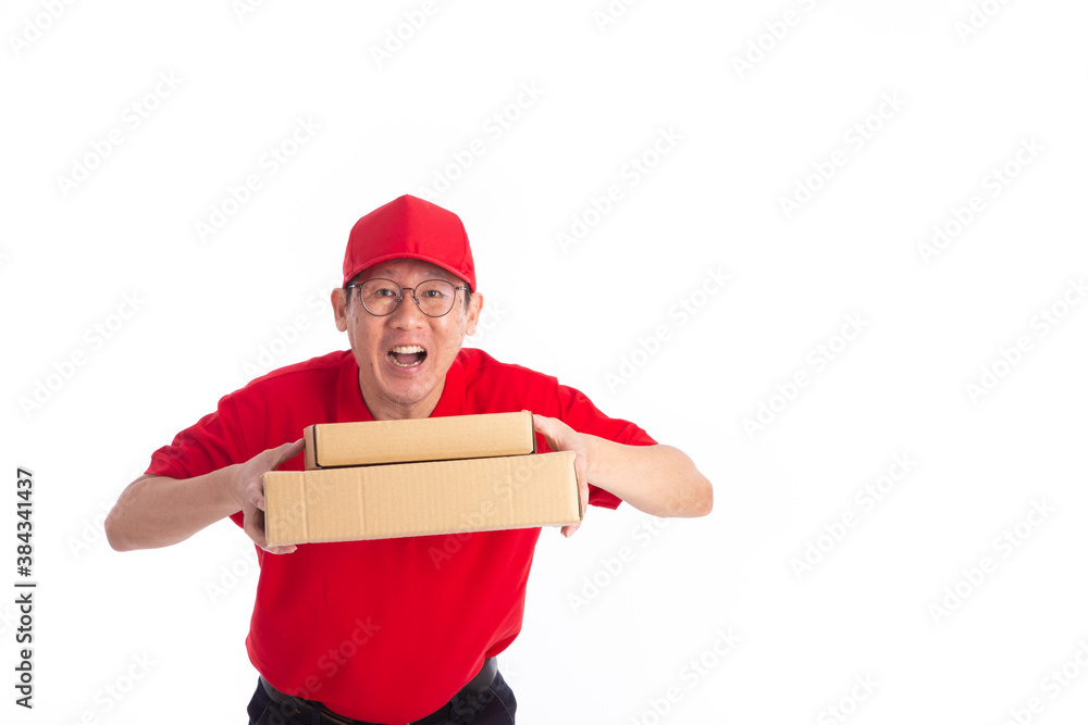 young Asian delivery man in red uniform, carry cardboard box in hands isolated on white background. young Asian delivery man in red uniform, carry cardboard box in hands isolated on white background.