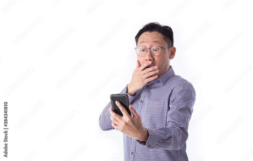 Surprised face of Asian man shocked what he see in the smartphone Surprised face of Asian man shocked what he see in the smartphone