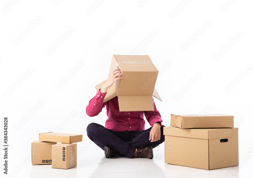 Fototapeta premium man cover his head with cardboard and confused on courier parcels.