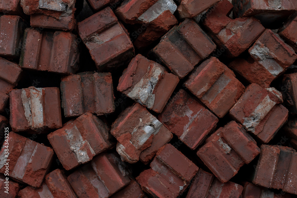 Pile of old red brick in the construction site.