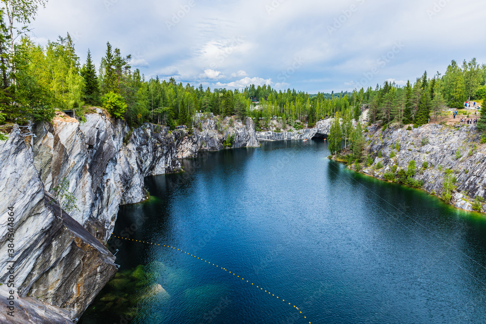 Fototapeta premium Marble Lake in Ruskeala Mountain Park. Karelia, Russia. An old abandoned quarry, which delivered stone for almost three centuries, a monument to the industrial history 