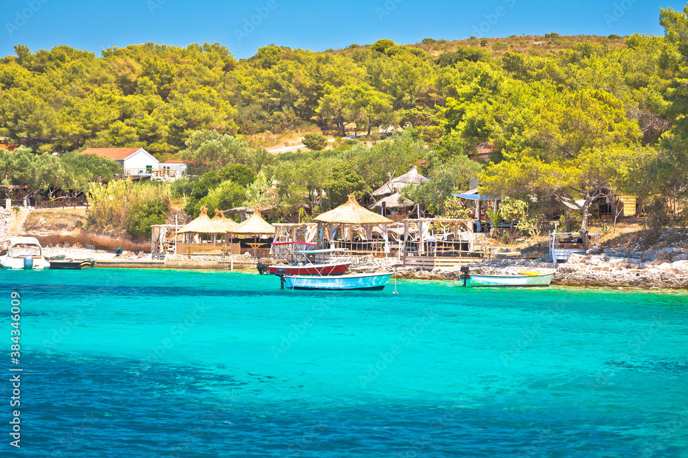 Beach bars in Palmizana bay, leisure destination in Hvar archipelago of Croatia