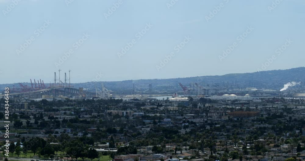 Pollution coming from smoke stack at a factory beyond the Vincent Thomas Bridge in Long Beach California Pollution coming from smoke stack at a factory beyond the Vincent Thomas Bridge in Long Beach California