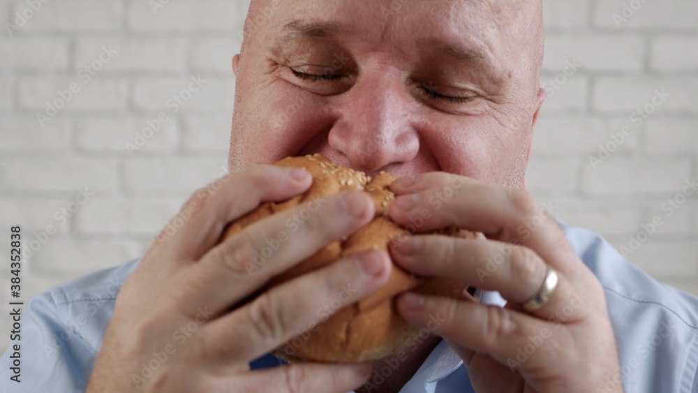 Hungry Person Eating a Tasty Hamburger, Enjoy Delicious Fast Food Hungry Person Eating a Tasty Hamburger, Enjoy Delicious Fast Food