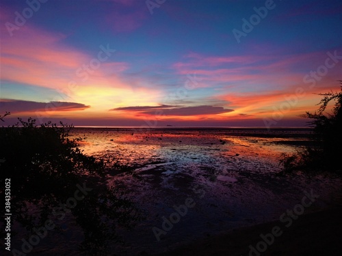 Colorful sunset over low tide