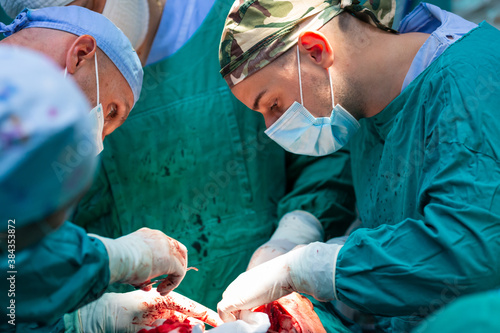 Team of surgeons operating in hospital