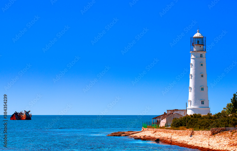 Lovely white lighthouse on the coast of the Black sea