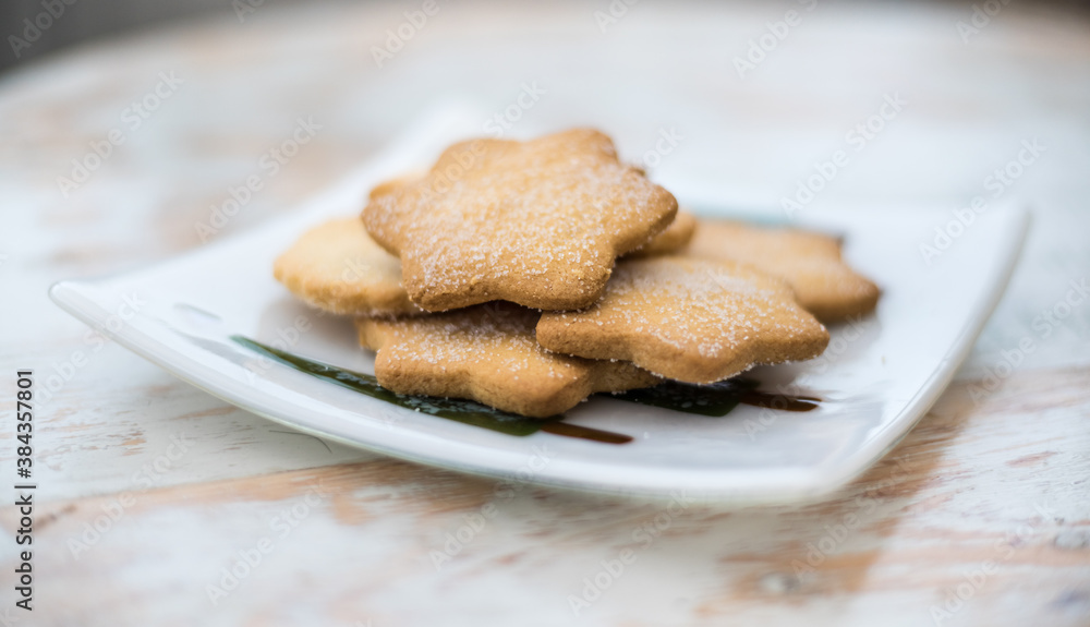 Shortbread - traditional Scottish treats on white plate Shortbread - traditional Scottish treats on white plate