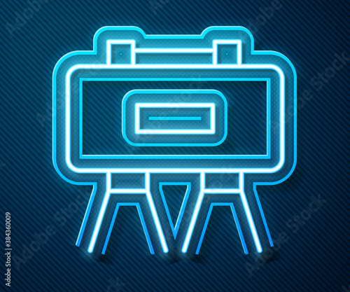 Glowing neon line Military mine icon isolated on blue background. Claymore mine explosive device. Anti personnel mine. Army explosive. Vector. photo