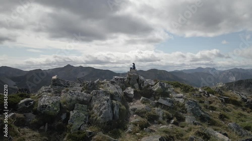 Aerial Backward Mountain Summit with a Bear on the Top indicating the End. Healthy Mountaineering Lifestyle in a Rocky Environment. Asturias, Spain.