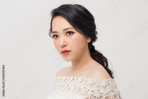 Fashionable photo of elegant Asian young girl with nice hairstyle