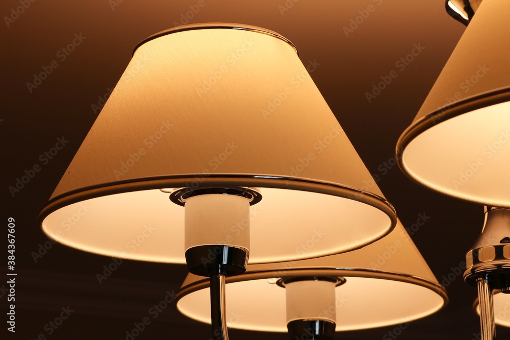 White round lampshade with orange light White round lampshade with orange light