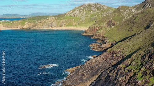 Boyeeghter Bay, commonly known as Murder Hole Beach, is one of the most beautiful beaches in Ireland situated on the Melmore Head Peninsula in County Donegal. Majestic Atlantic waves on sandy beaches photo